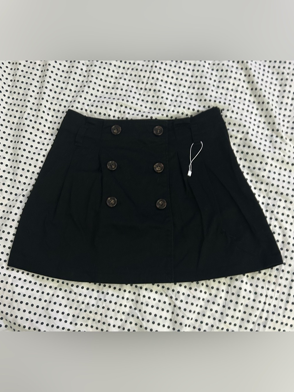 Double button pleated mini skirt